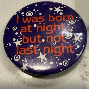 Bluish Purple Button with Orange Text